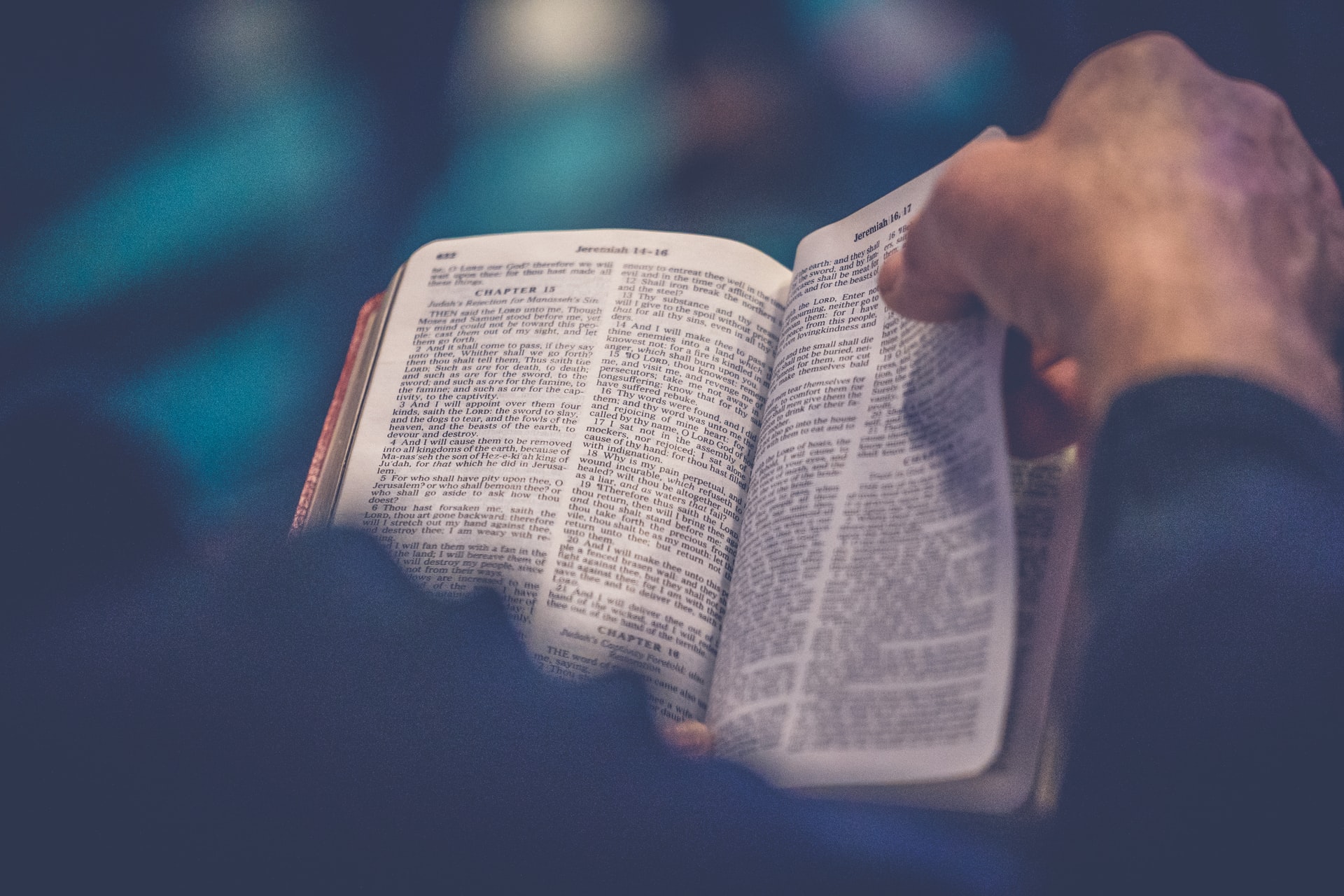 Man flipping Bible page