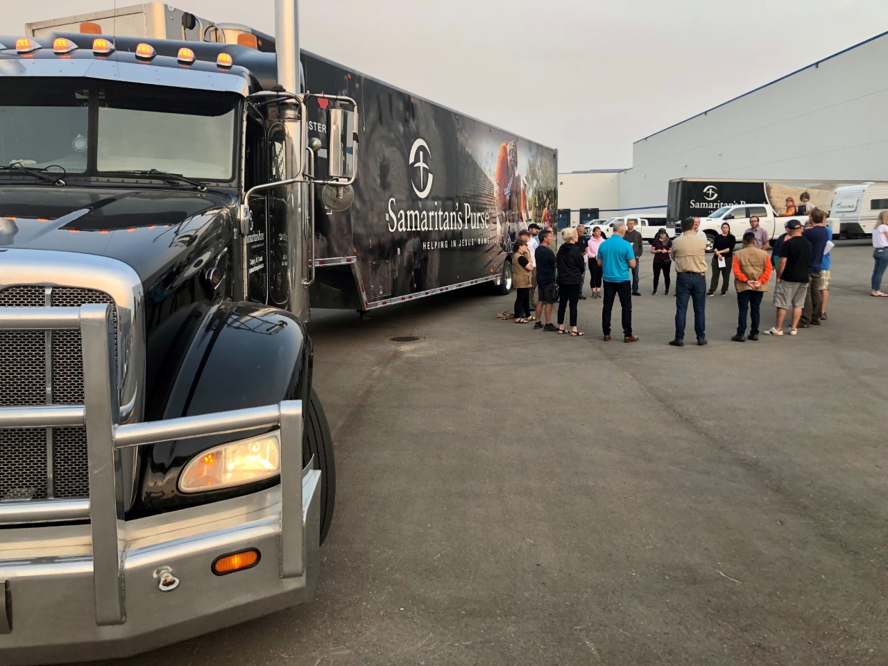 A group of volunteers with Samaritan's Purse pray before headed out to B.C. to help with the wildfires. 