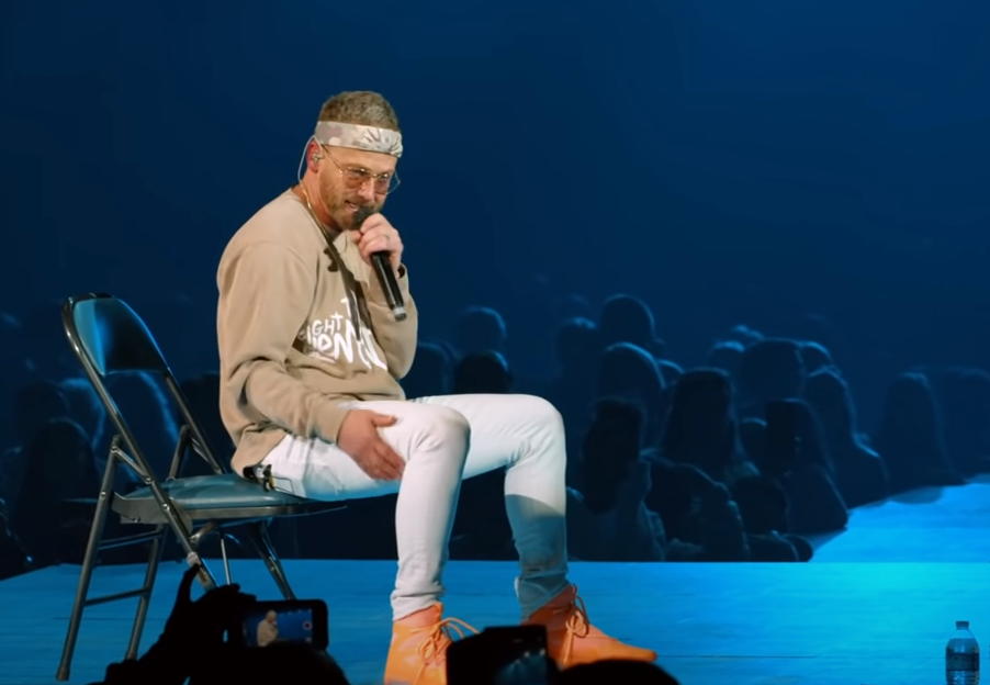 TobyMac opening up to fans on stage.