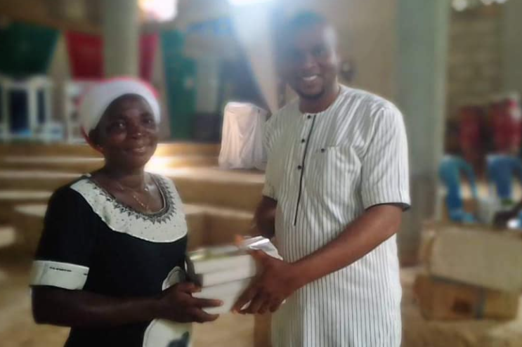 Pastor in Nigeria handing out Bibles. 