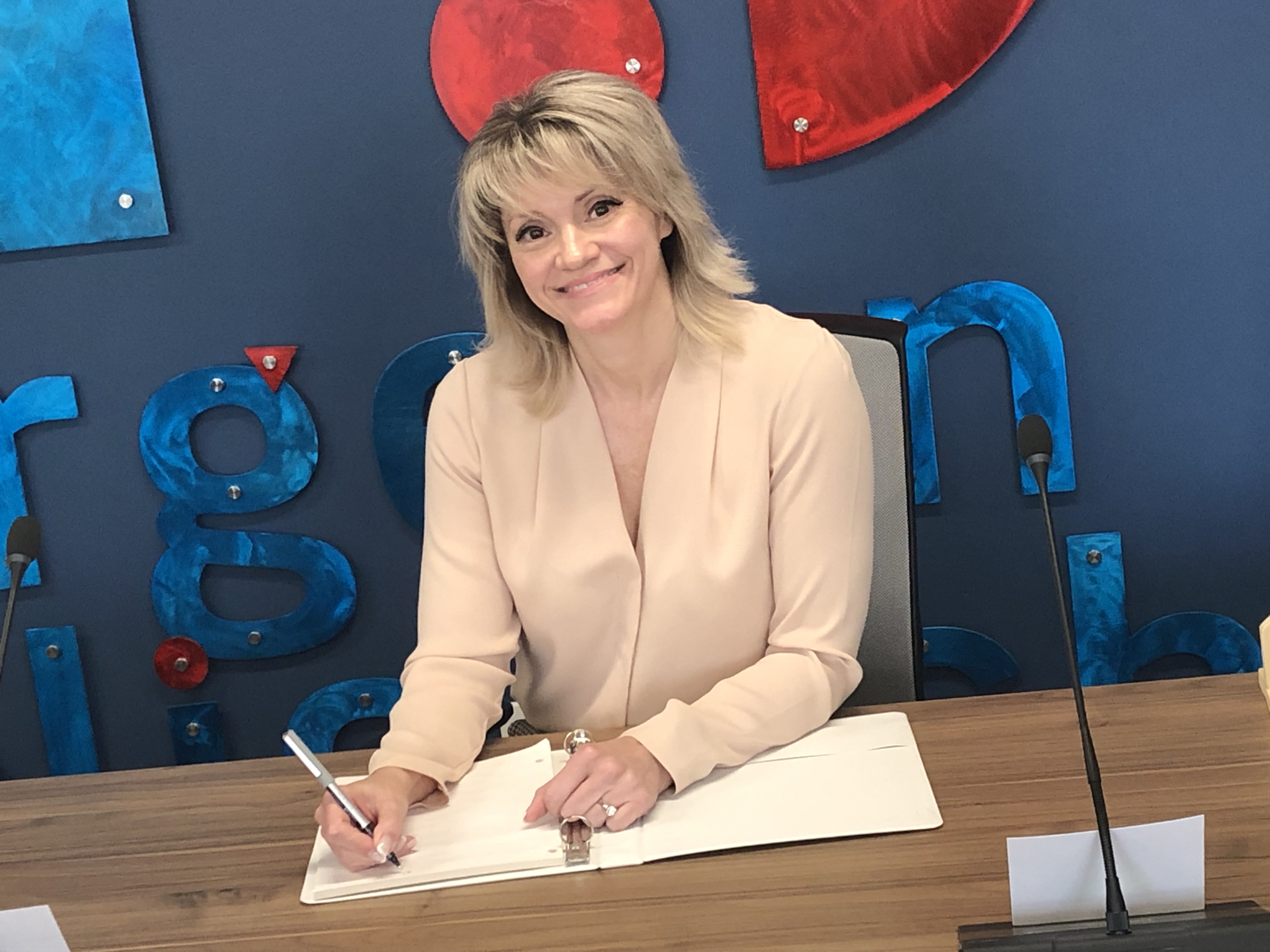 Shawna Walter writing at a desk.