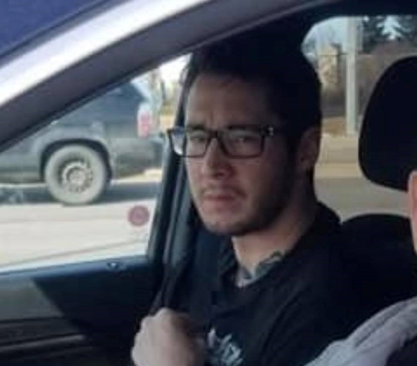Damien Starrett sitting in a vehicle.