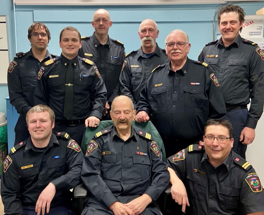 Robert Mitchell with sitting with other members of the fire department.
