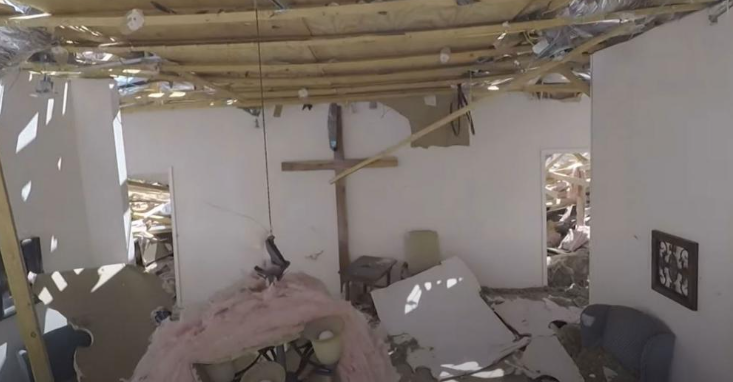 A cross still stands after a tornado ripped through a Texas community. 