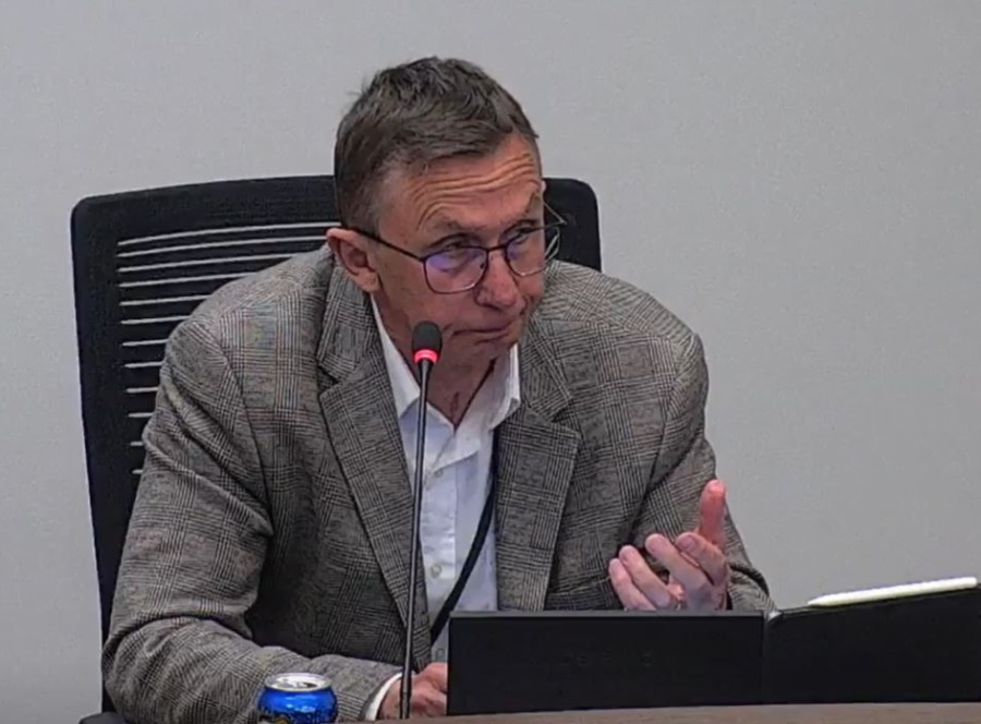 Gordon Harris sitting in council.