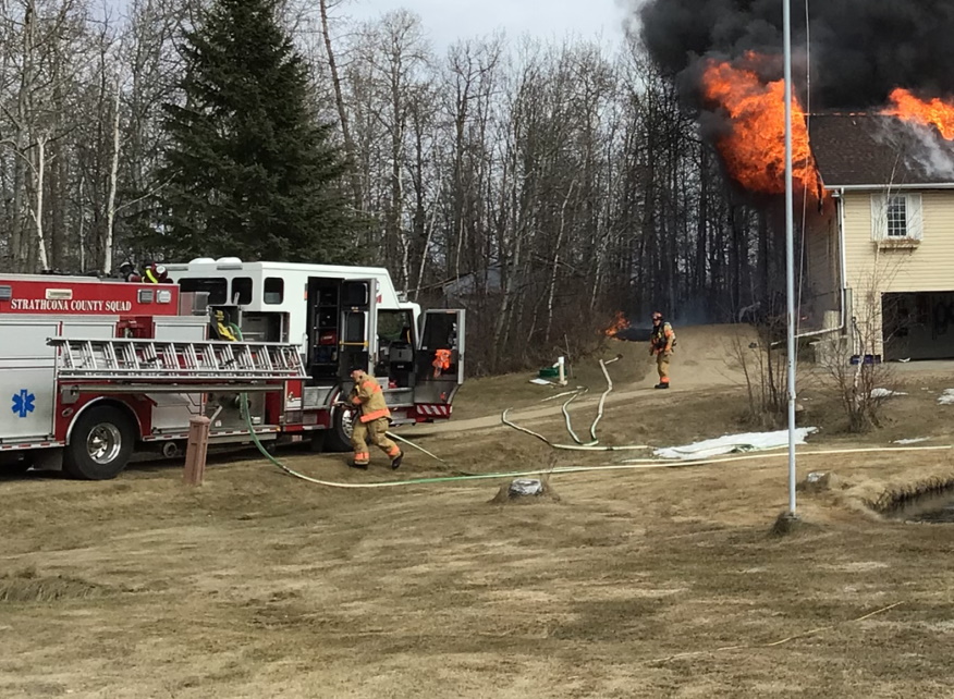 Strathcona County firefighters working to put out a house fire.
