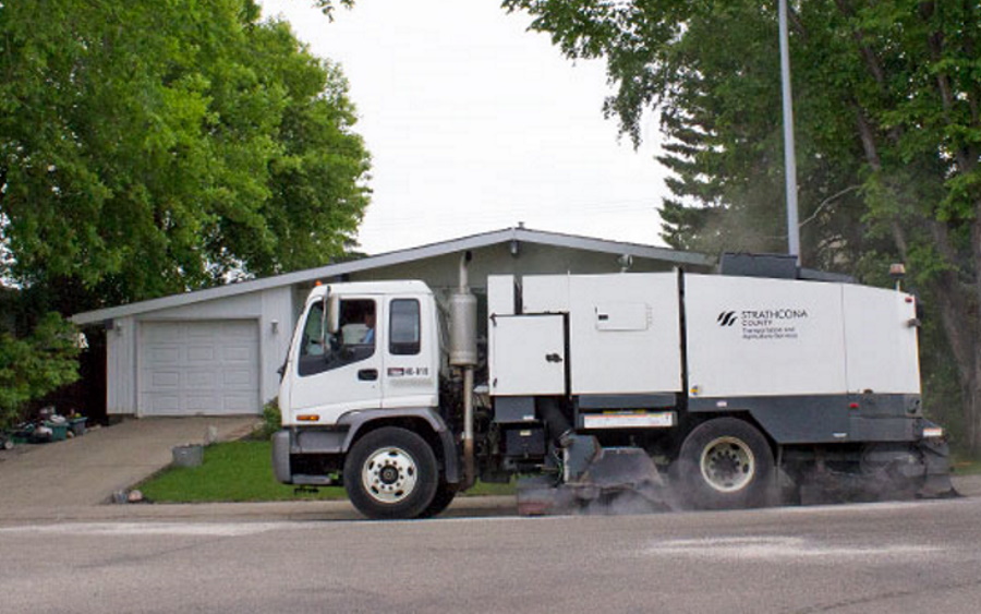 A Strathcona County street sweeper cleaning the road.