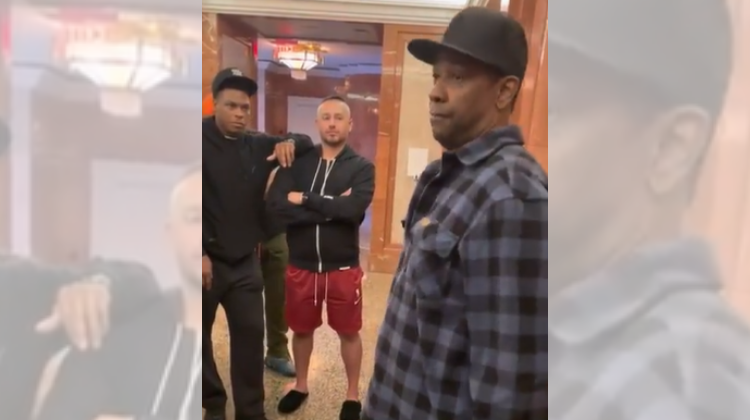 Denzel Washington sharing advice with NBA players. 
