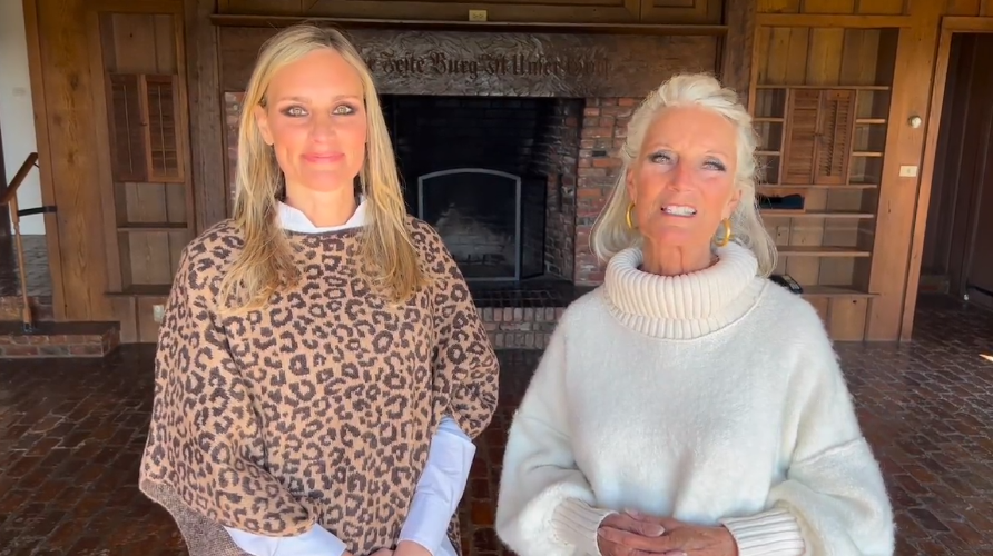 2 women, a mother and daughter, stand side-by-side