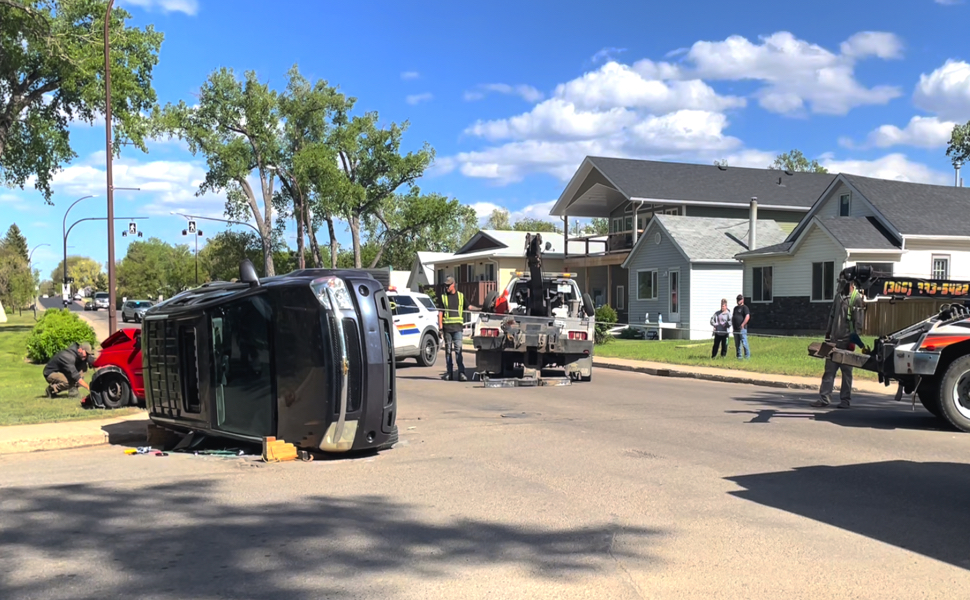A SUV flipped over on it's side.