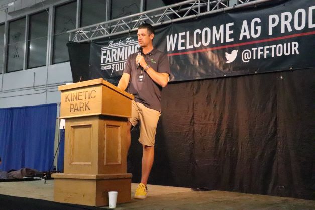 Brian Voth speaking at a podium 