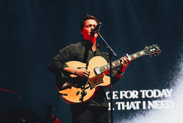 Pat Barrett performing on stage. 