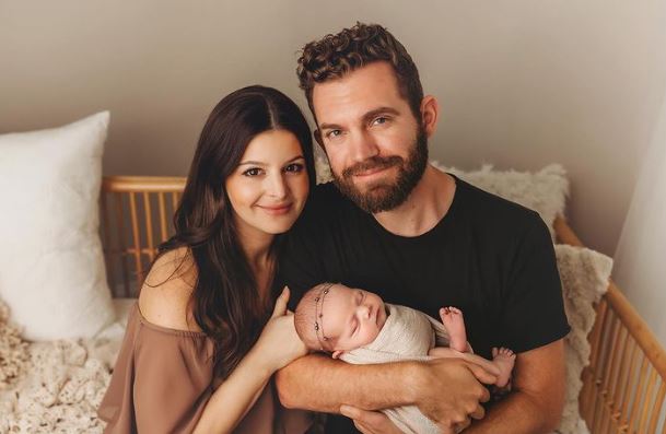 Seth and Hilary Morrison with their baby girl. 