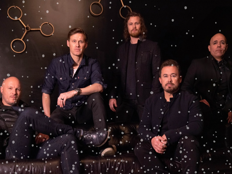 5 white guys sitting on black couch with snow effect in foreground (buiding 429/fb)