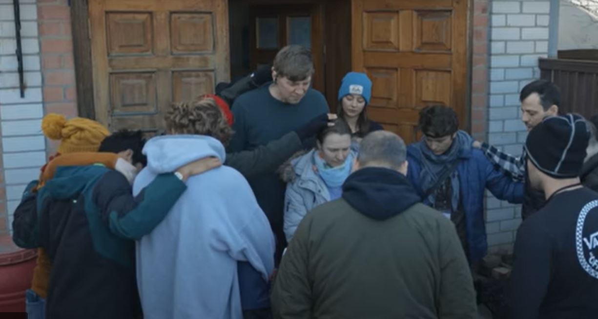 A Jesus Mission praying over Ukrainians during the war. 