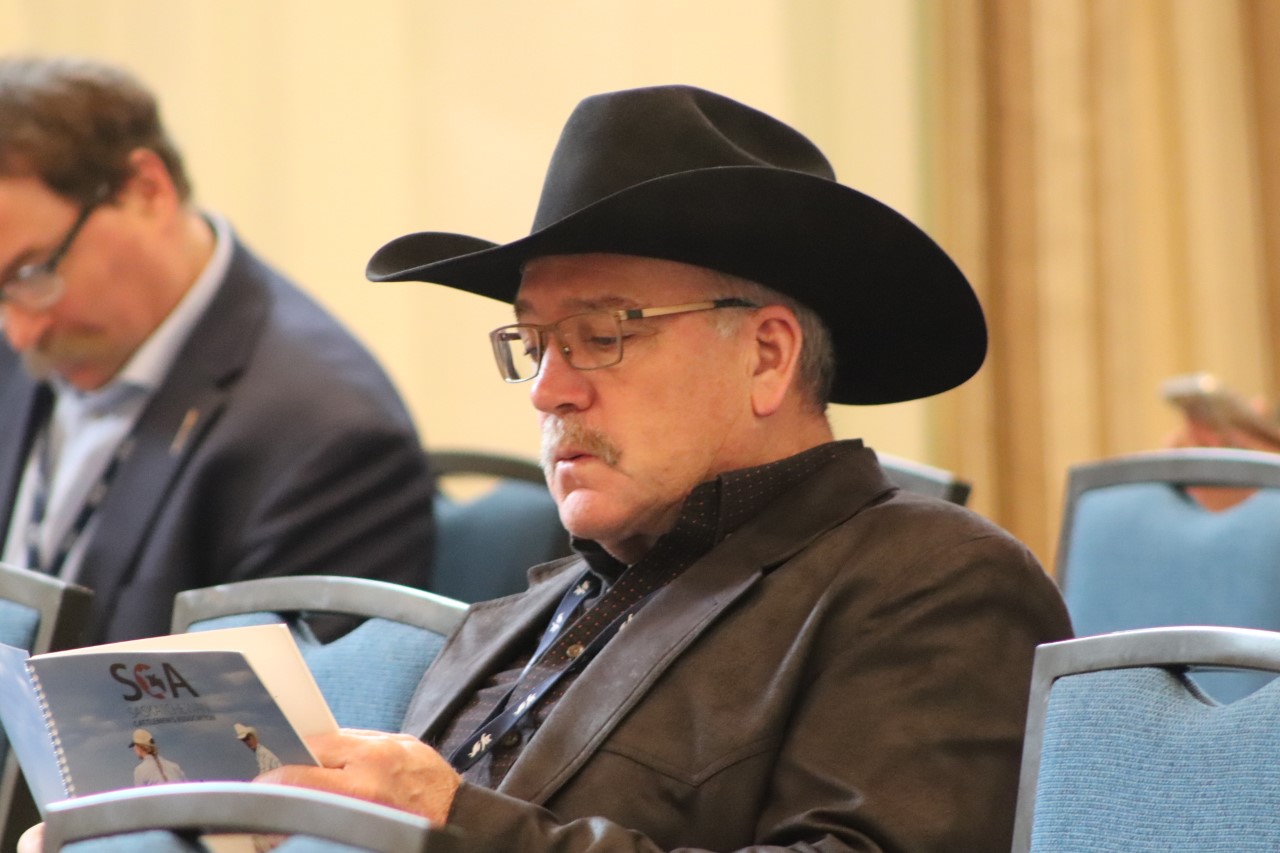 Photo of Keith Day reviewing SCA report
