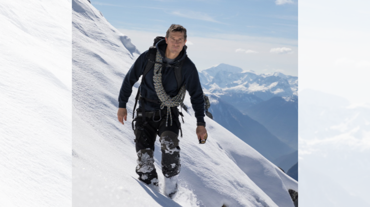 Bear Grylls on the side of a mountain. 