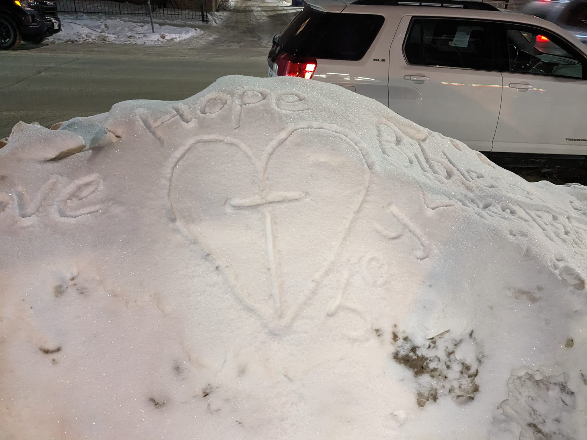 Someone wrote in the snow outside of the new Set the Captives Free building. 