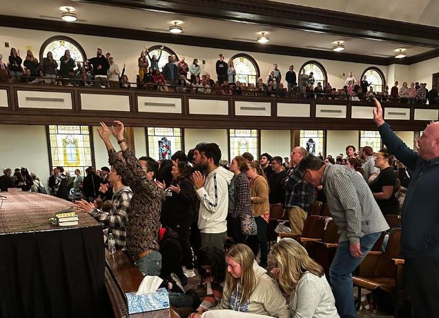 Hughes Auditorium at Asbury College in Kentucky, filled with people praising God for over 200 hours.