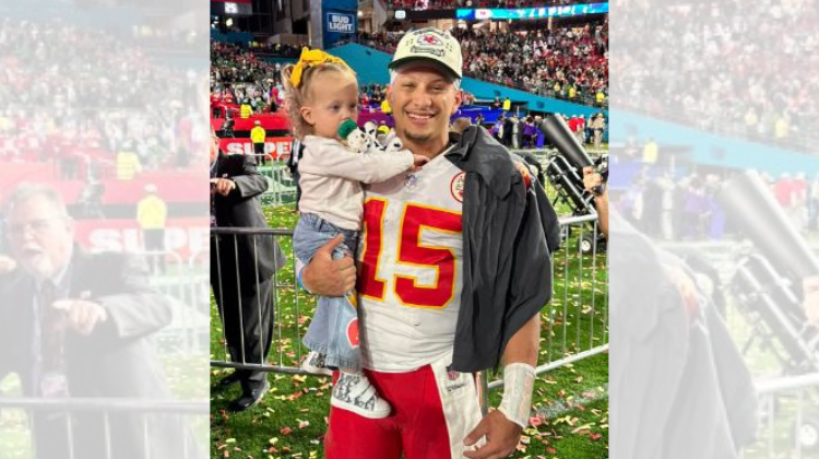 Quarterback Patrick Mahomes holding his daughter after winning the superbowl on February 12, 2023.