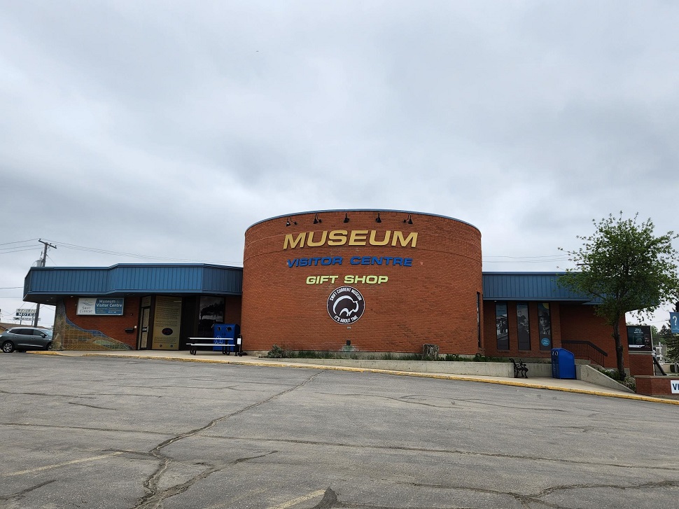 An outside view of the Swift Current Museum, which is made of brick with a round face.