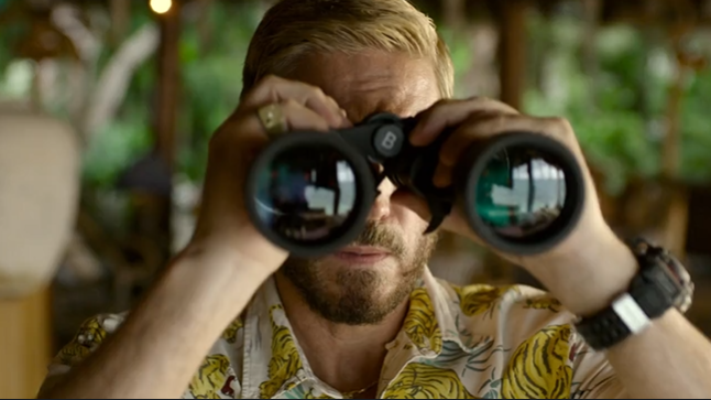 a man with short blonde hair looks intensely at the camera