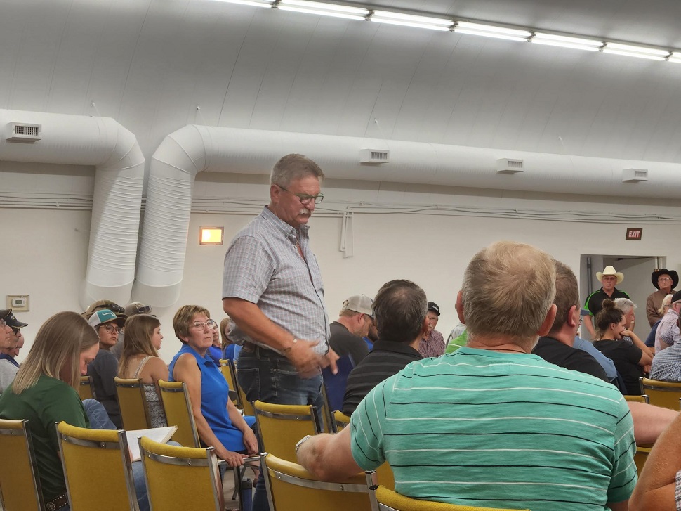 Doug Steele, MLA for Cypress Hills, speaking to the crowd at the meeting.