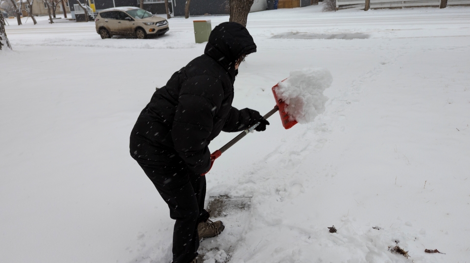 A man shovelling snow