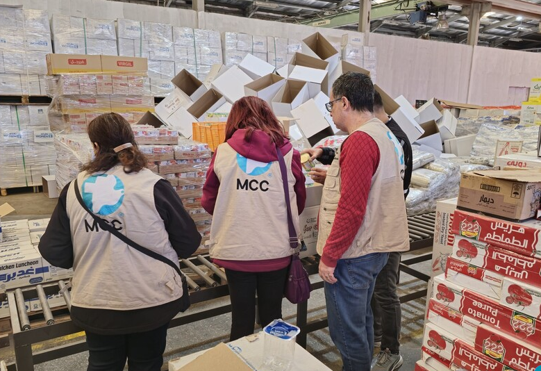 MCC workers in a warehouse.