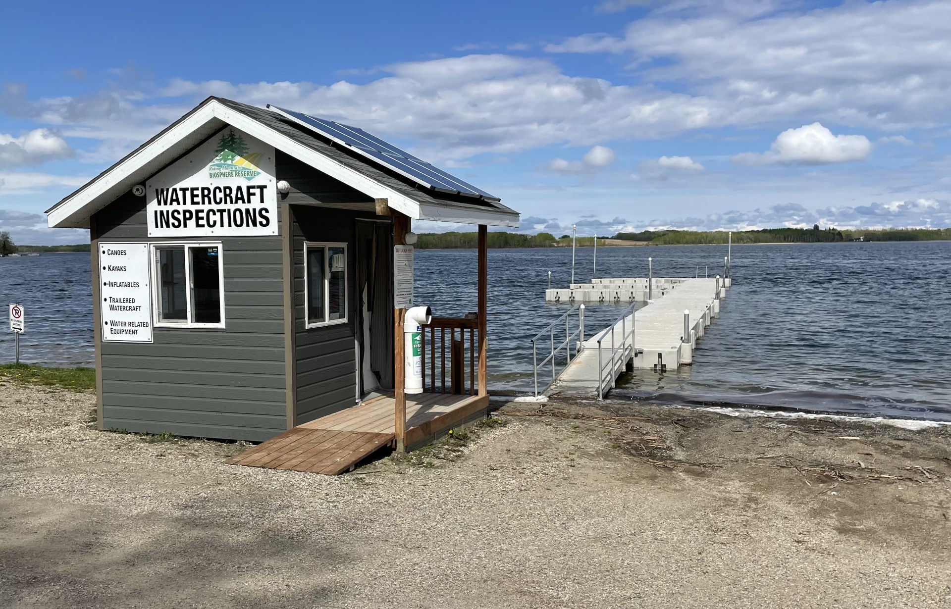 an inspection building at a lake boat launch
