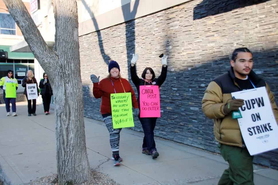 A group of people on the picket line. 