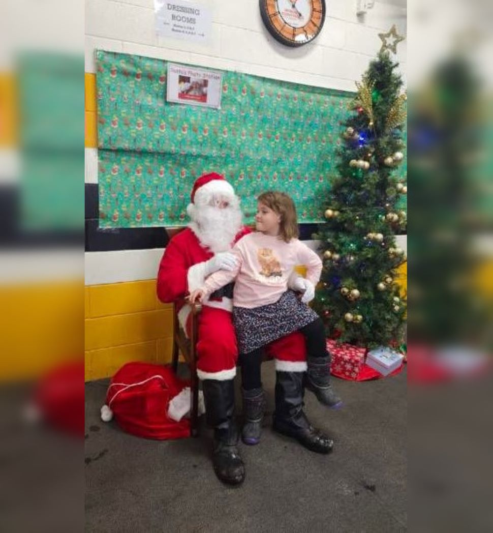 Lampman Frosty Fest, child sitting on santa's lap