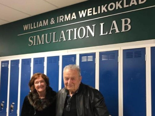 Irma and Bill Welikoklad in front of the Welikoklad Simulation Lab.