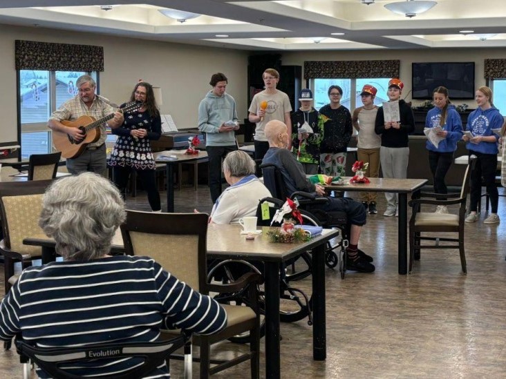 Olds students visit seniors living facility for “Stockings for Seniors” campaign.