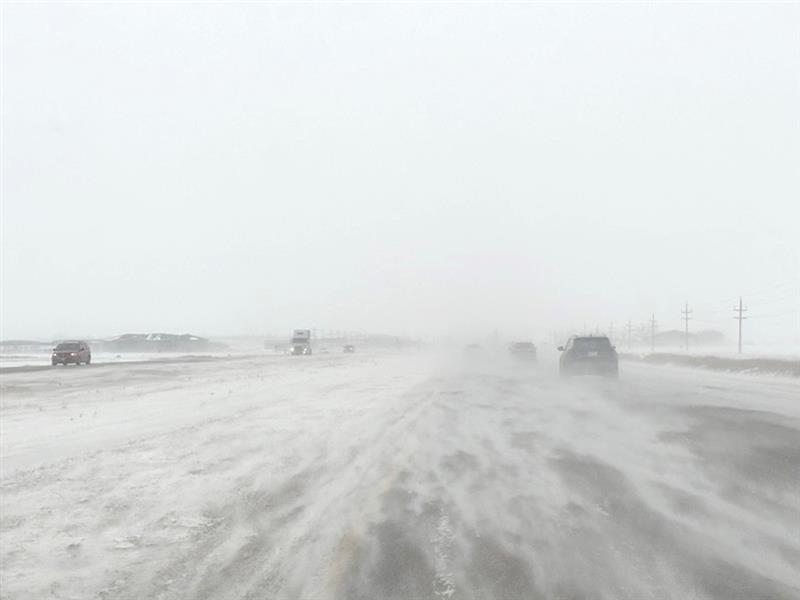 blowing snow on the highway