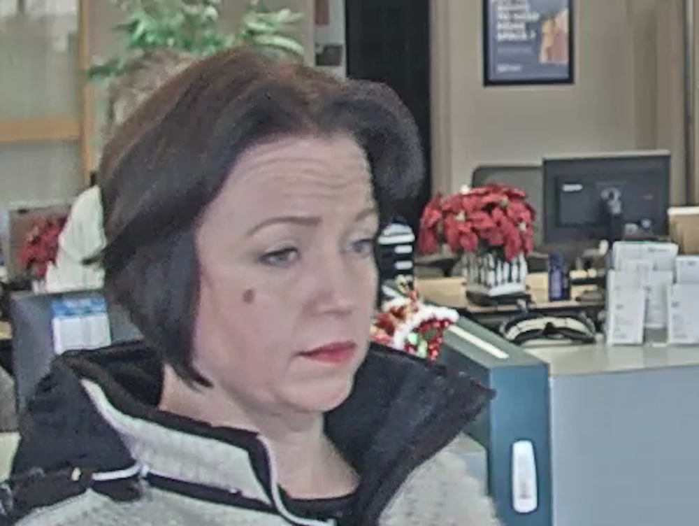 Police are looking for a woman involved in bank fraud in Three Hills.