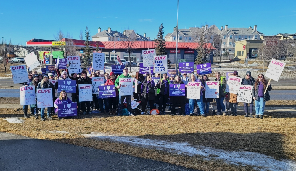 CUPE Local 5040 members picketing near the Foothills Composite High School on February 24, 2025. OkotoksOnline/Harrison O'Nyons