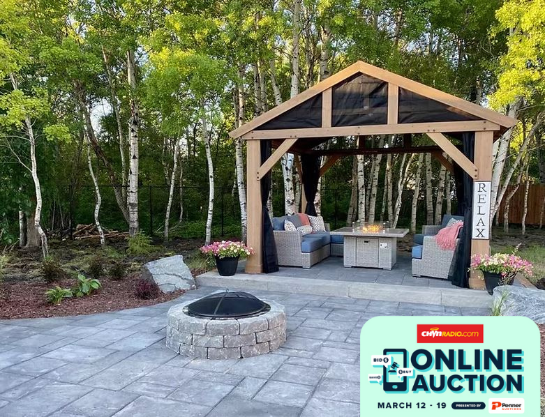 a backyard patio with firepit and a gazebo