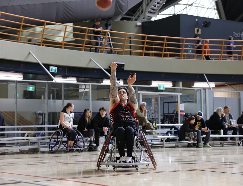 Ryan Straschnitzki playing wheelchair basketball.