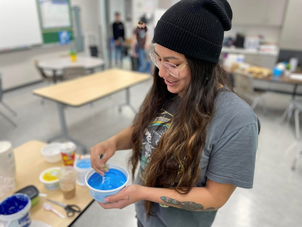 An artist mixing paint