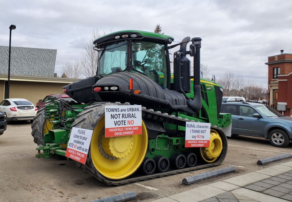 A tractor parked in front of the Foothills County administration building.