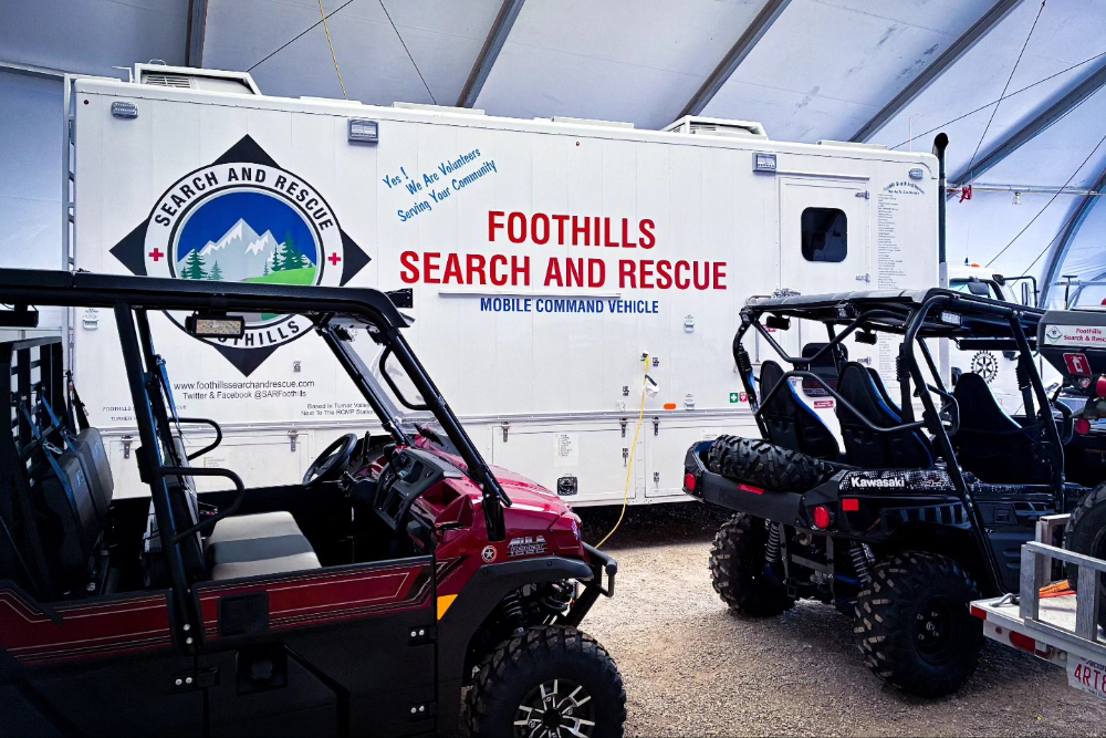 The new side-by-side vehicles and trailer purchased by Foothills Search and Rescue.