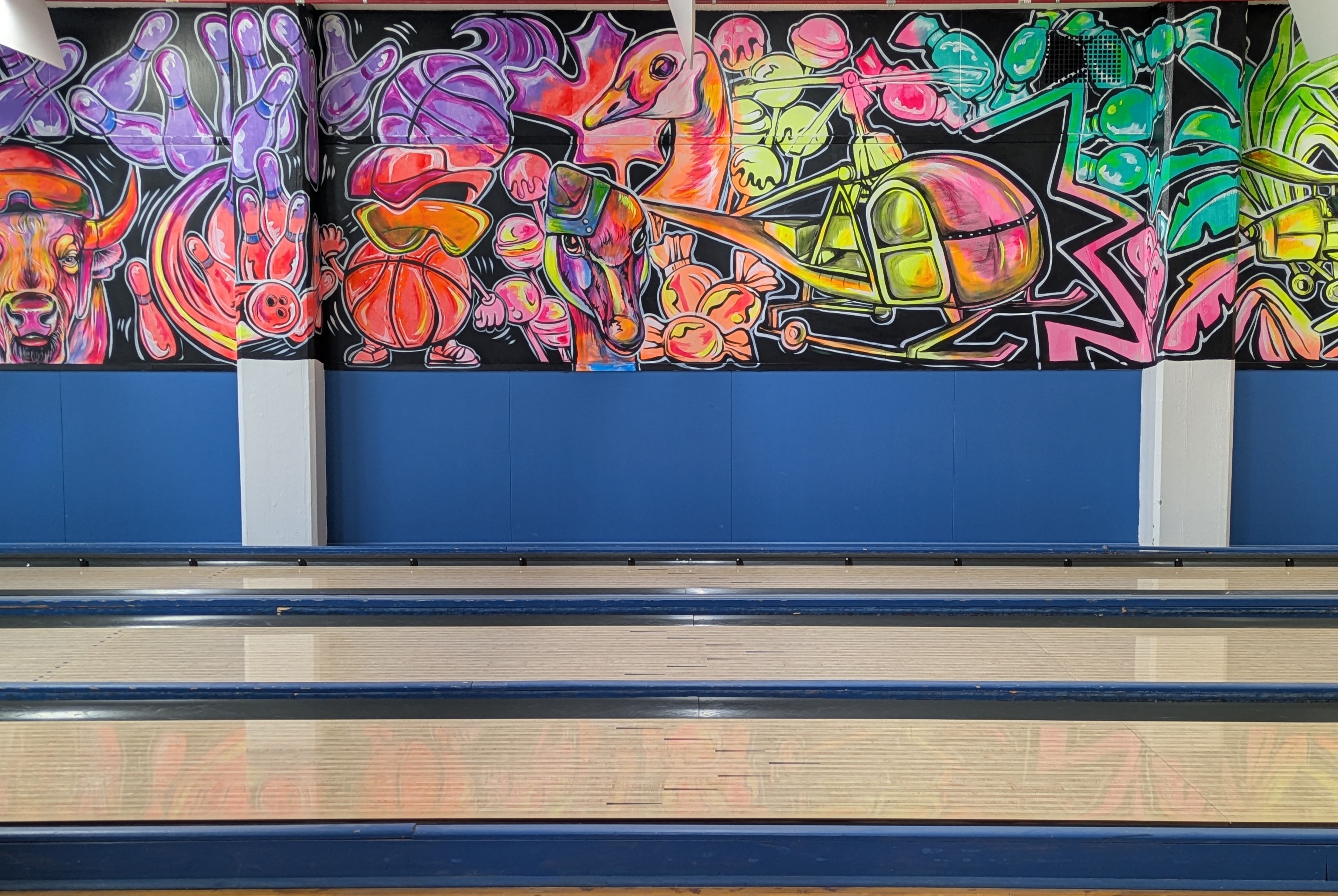 The new mural at Southport Bowl, freehanded by Rachel Lancaster with glow paint