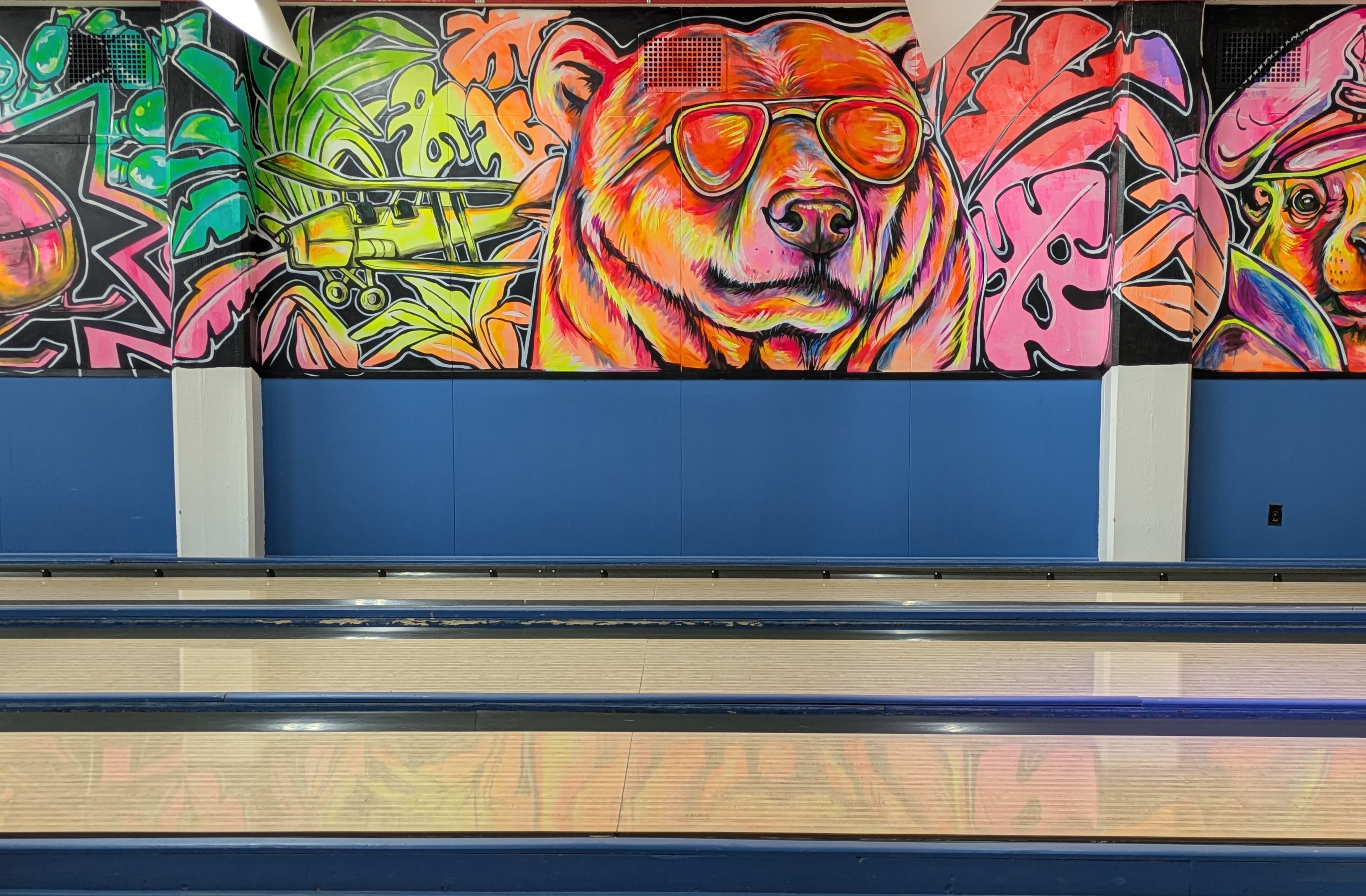 The new mural at Southport Bowl, freehanded by Rachel Lancaster with glow paint
