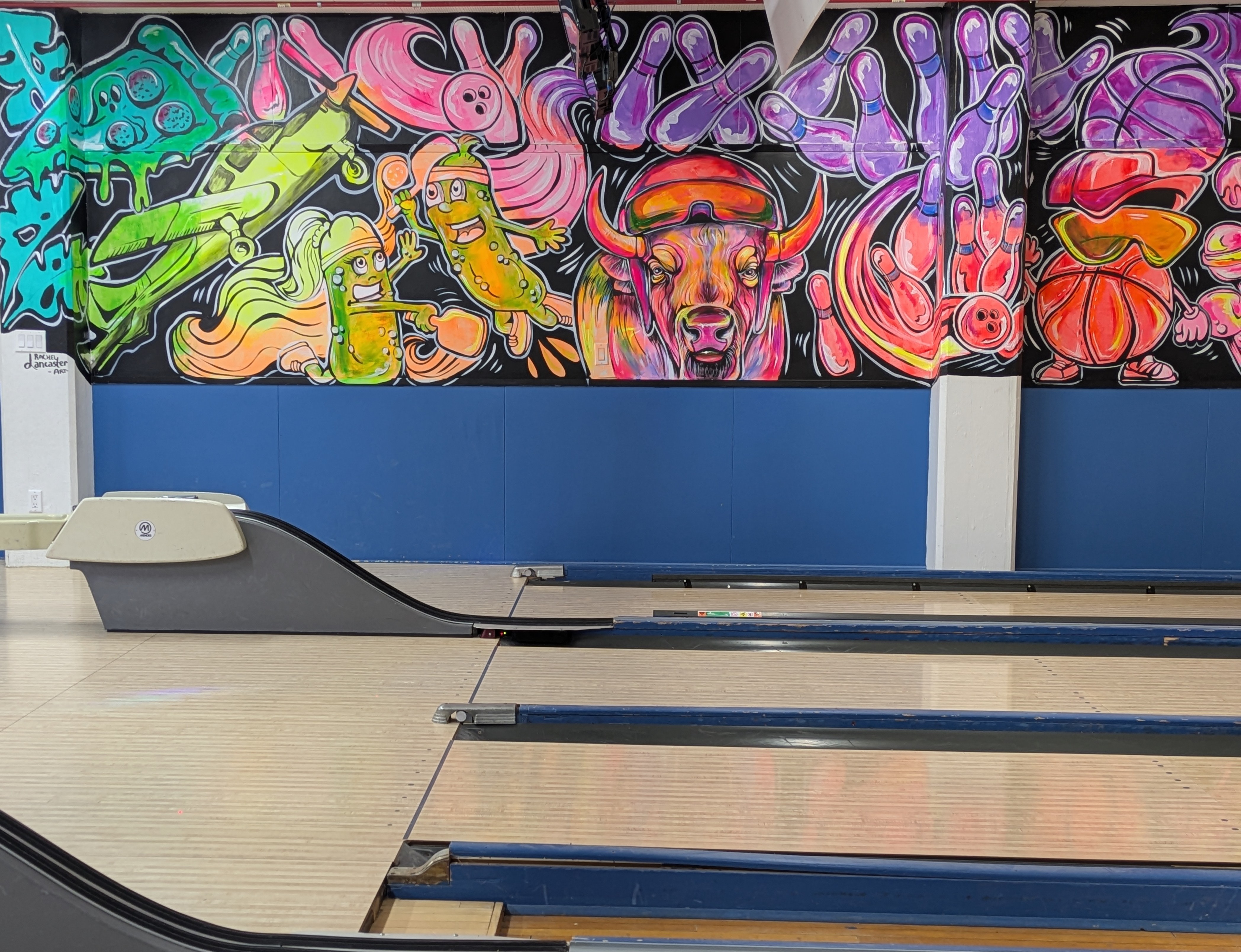 The new mural at Southport Bowl, freehanded by Rachel Lancaster with glow paint