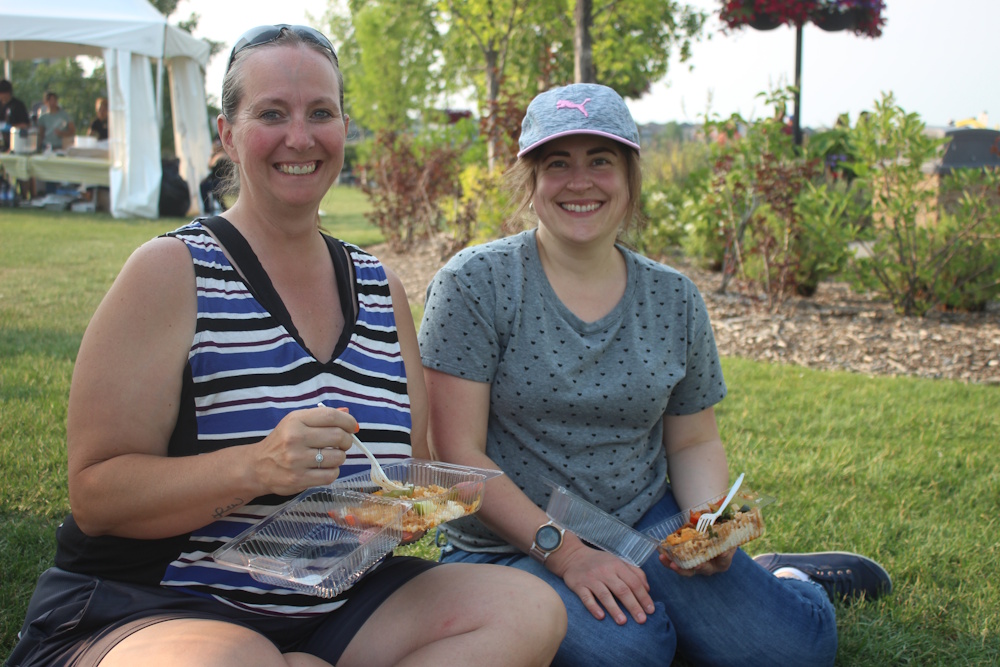 Chestermere residents sitting in John Peake Park.