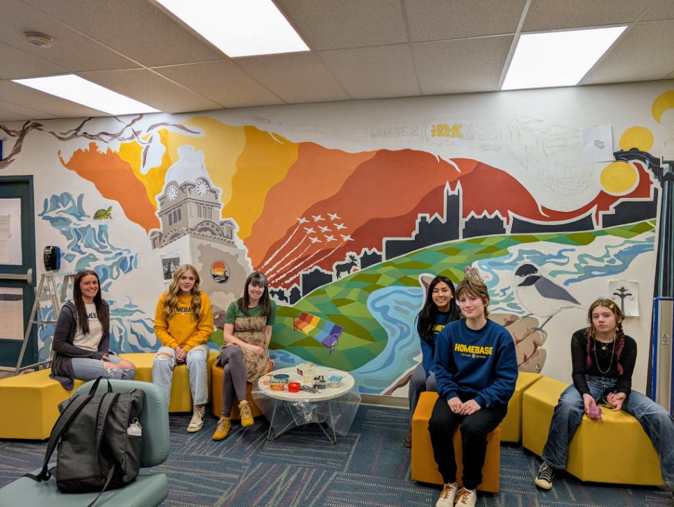 Mural contributors at HOMEBASE Moose Jaw, (l-r) Jill Lesuk, Macy Kuntz, Jess Zoerb, Arlyn Daquina, Aria Swanson, and Lucy Zoerb (photo by Gordon Edgar)