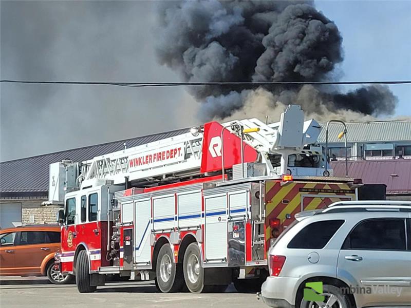 smoke behind a fire truck 