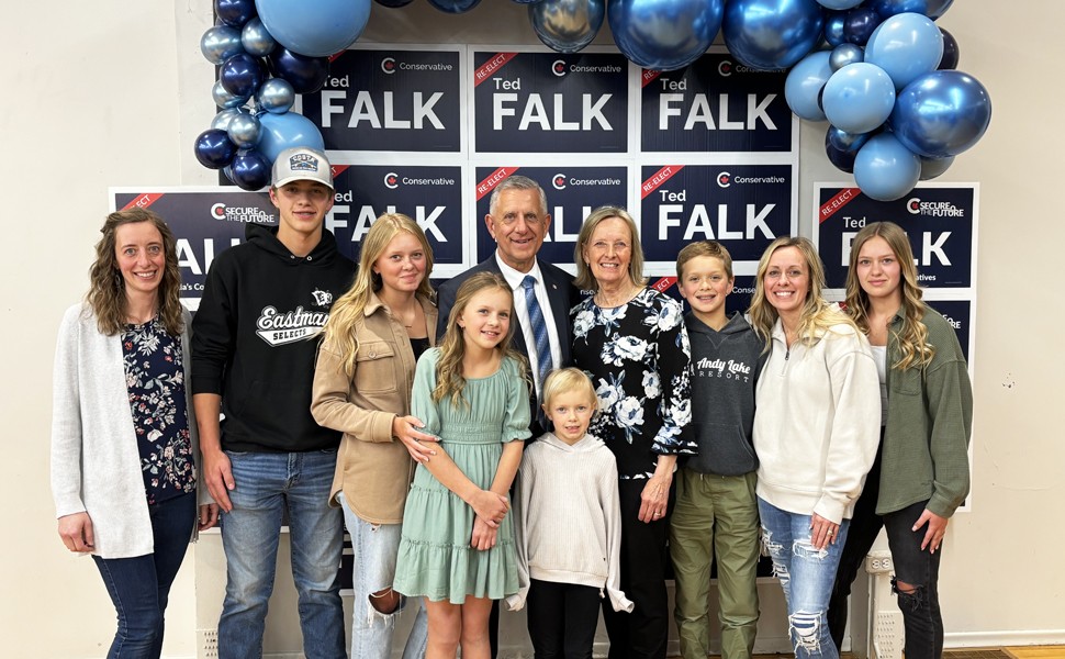 Ted Falk surrounded by family
