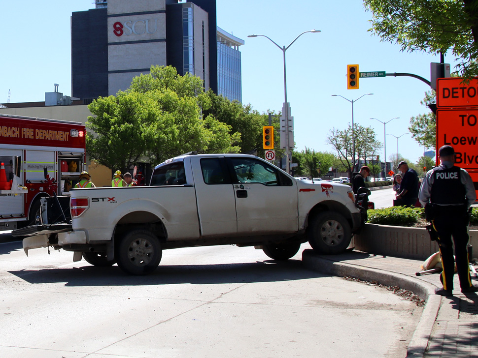 truck on curb on main street